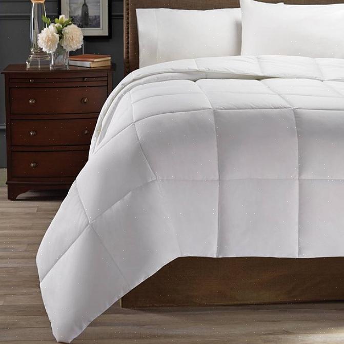 La den ligge på flekken i minst 15 minutter før du legger dynen til vaskemaskinen